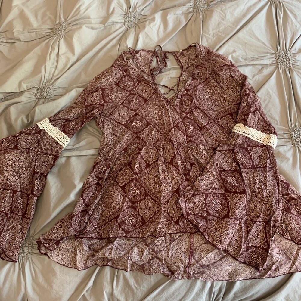 Burgundy peplum style top with bell sleeves